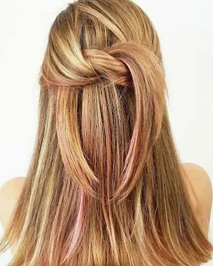 Strawberry blonde, half-up with a soft knot and pink ribbons of color underneath